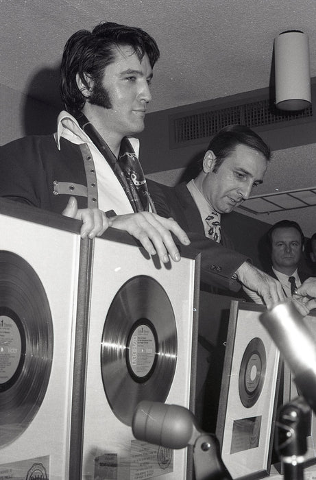 Elvis with Gold Records