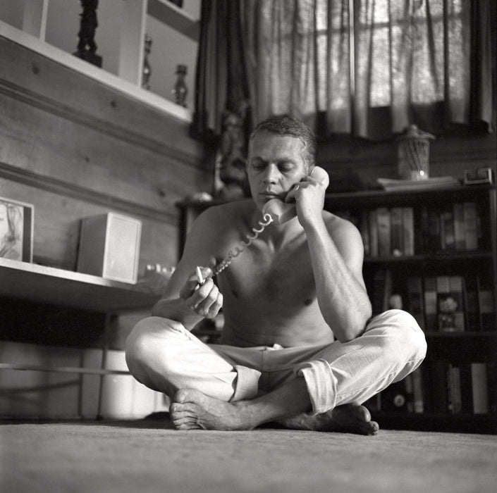 Steve McQueen talking on telephone at home by Larry Barbier Jr.