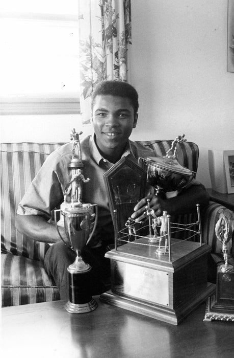 Muhammad Ali at Home with Trophies 1960s, by Curt Gunther