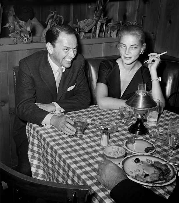 Frank Sinatra and Lauren Bacall at Musso & Frank's Grill in Hollywood, 1957 by Frank Worth